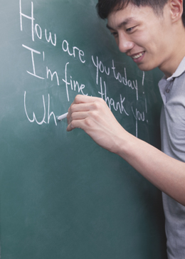 man writing on a chalkboard