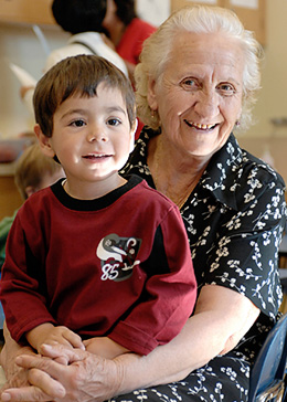 Pre-school child with caregiver engaged in learning