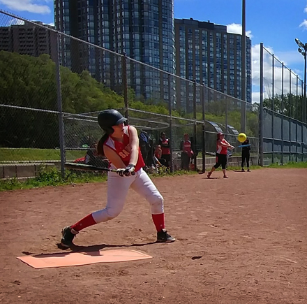 A girl is playing Slo-Pitch