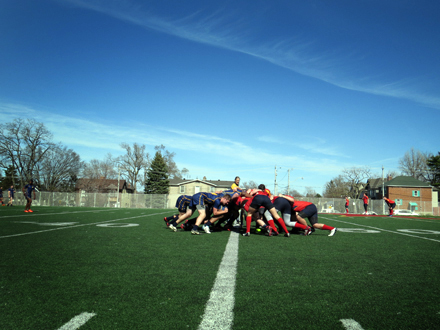 Senior boys from Northern SS and Lawrence Park CI scrum over the ball.