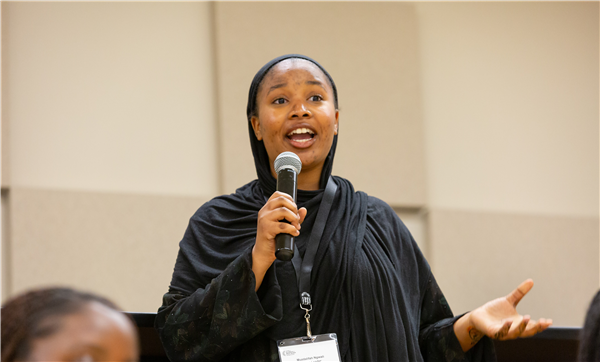 Image of student speaking through microphone