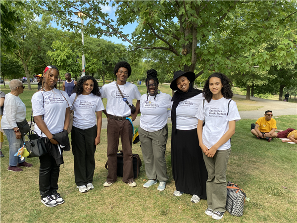 Peer mentors smile for a photo at the Emancipation Day event