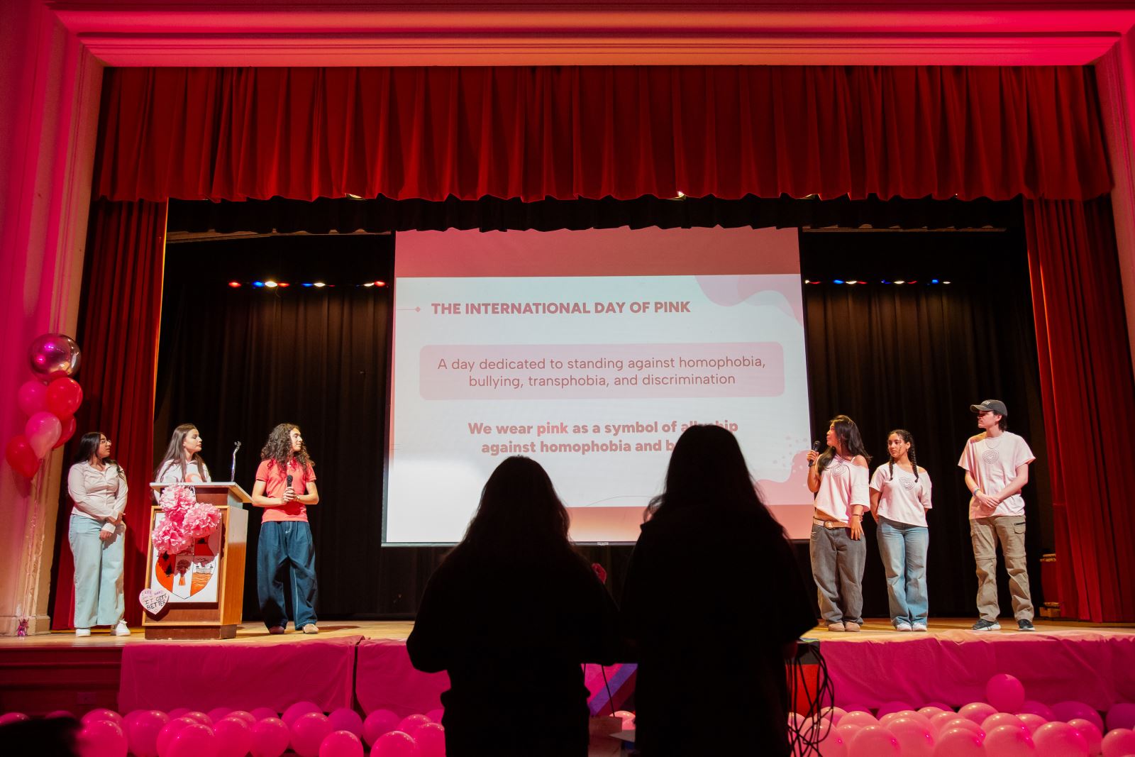 A group of students present on stage at Harbord CI for International Day of Pink.