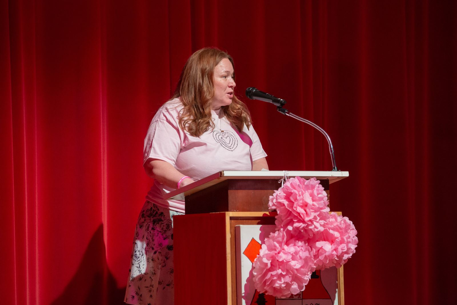 TDSB Interim Director of Education Stacey Zucker gives a speech behind a podium at the International Day of Pink event at Harbord CI.