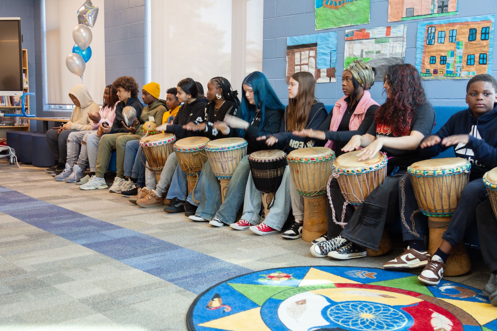 Students drumming.