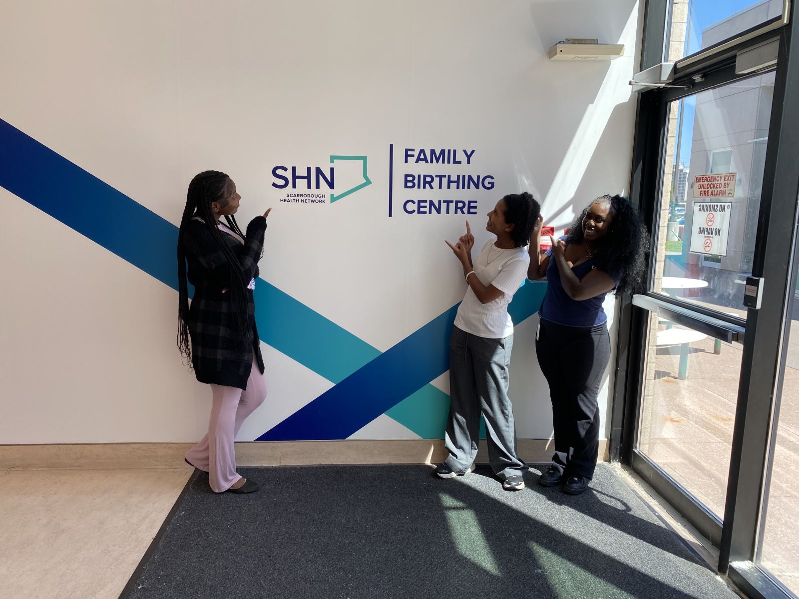 Students stand outside the Family Birthing Centre