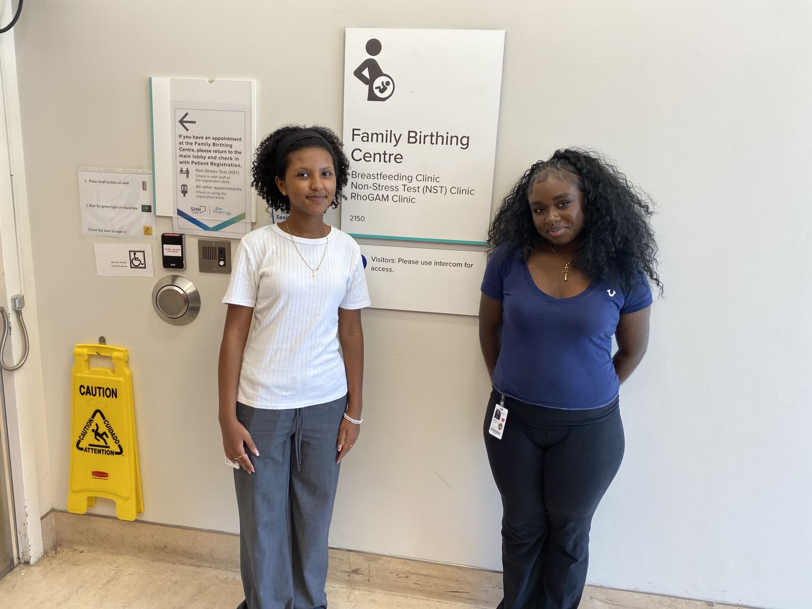 Students stand outside the Family Birthing Centre