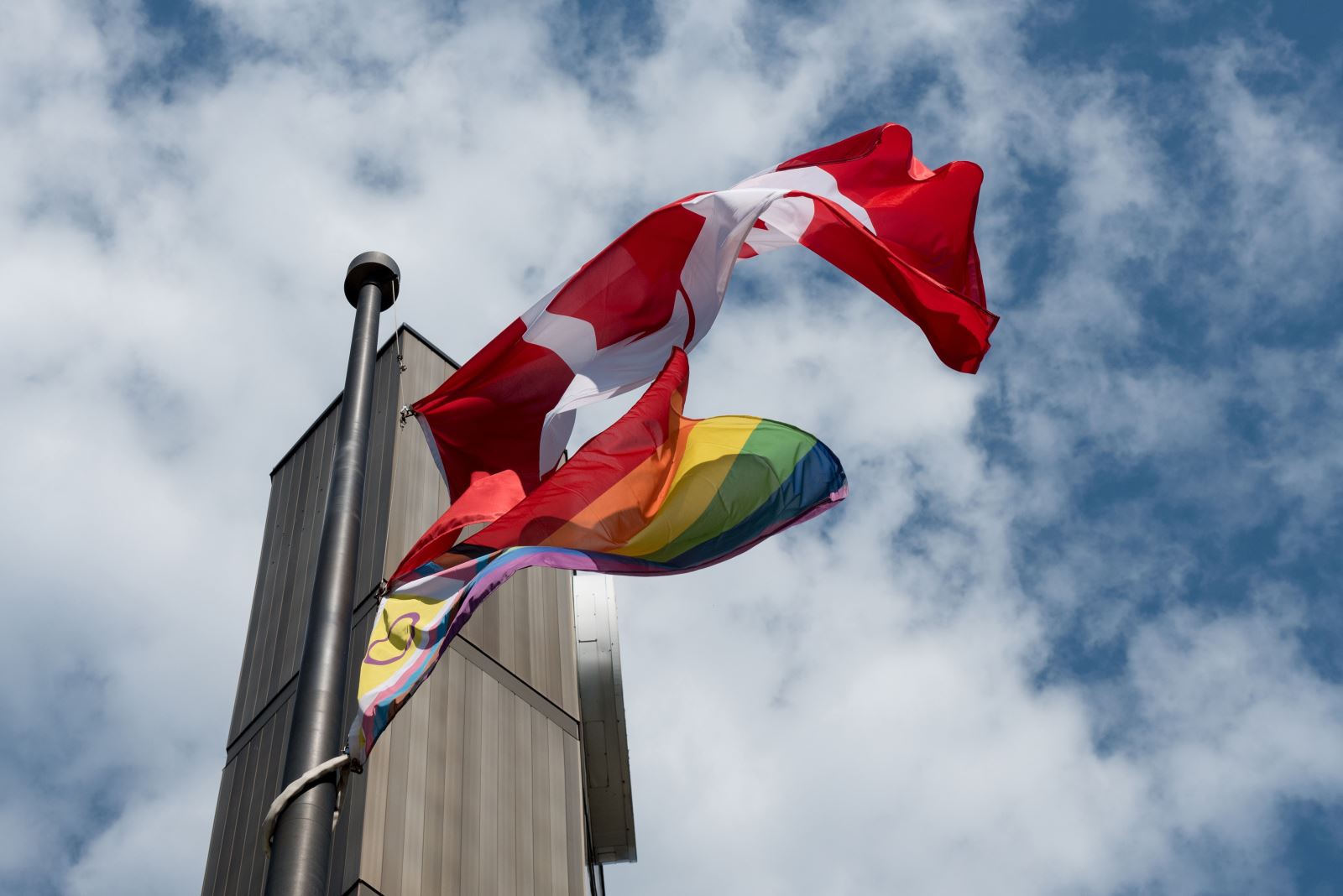 Canadian and Progress Pride flags.