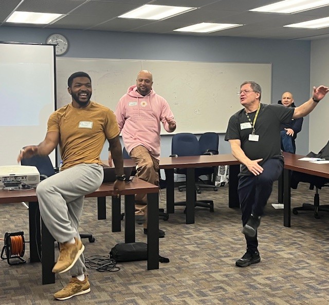 (left to right) Daniel Beard, social worker; Aubrey Noronha, mental health speaker; and Richard Filler, TDSB social worker, lead fitness exercises at 5100 Yonge Street.