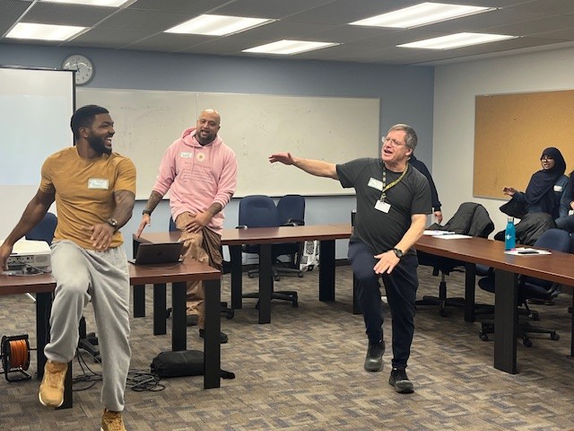 (left to right) Daniel Beard, social worker; Aubrey Noronha, mental health speaker; and Richard Filler, TDSB social worker, lead fitness exercises at 5100 Yonge Street.