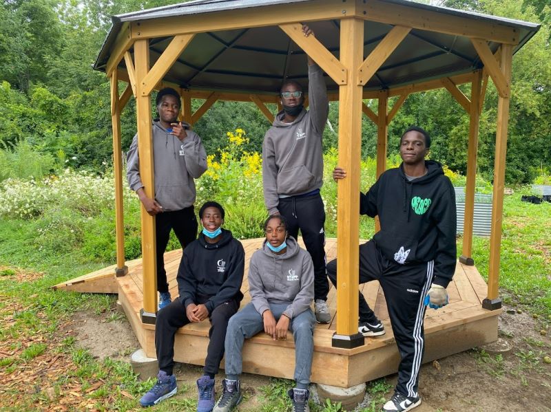 From left to right standing are students Judah, Rajay and Jayshawn. Seated are Philip and Kanye.