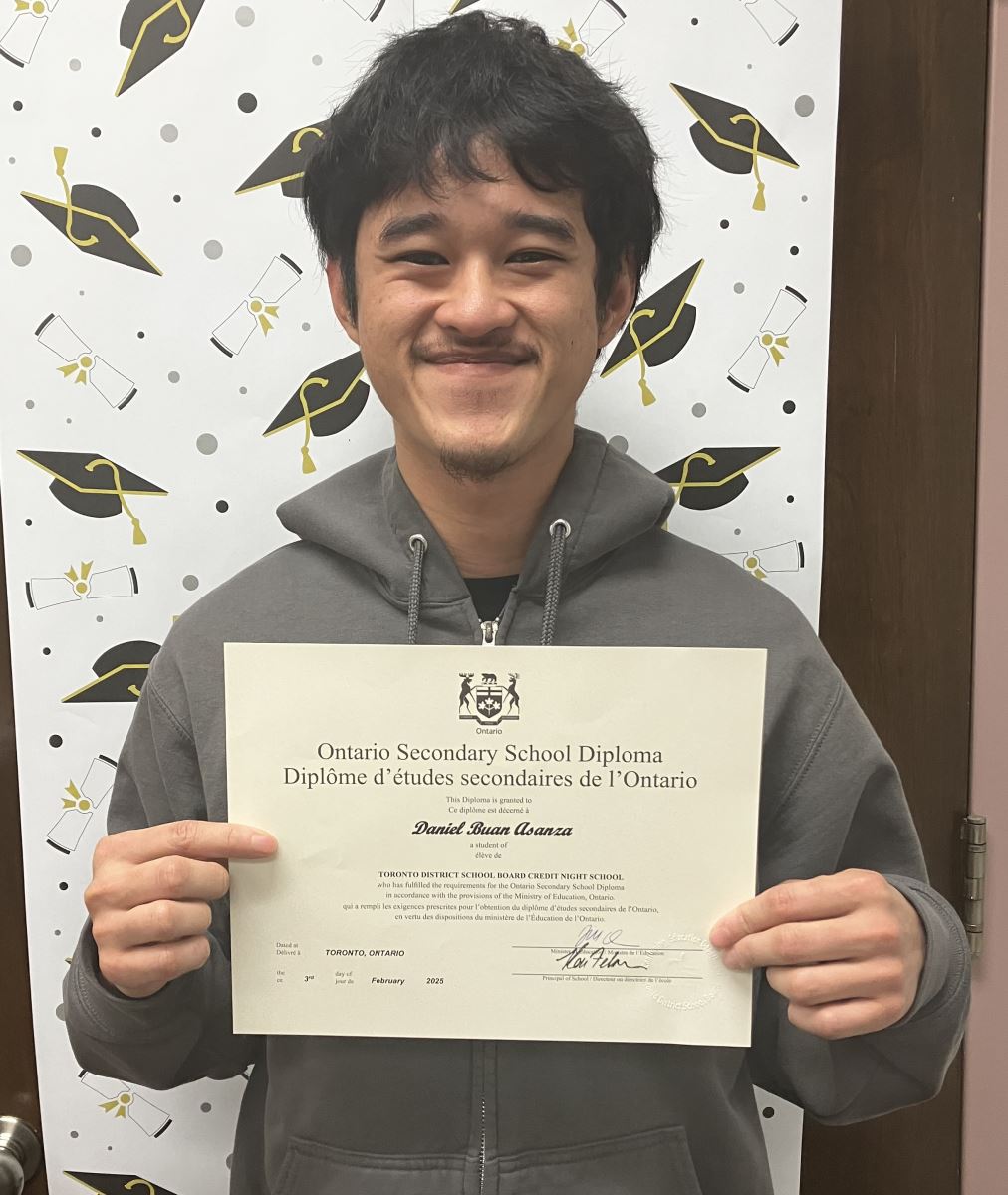 A school classroom door decorated with "Go Blue Jays" in children's writing and baseball cut outs