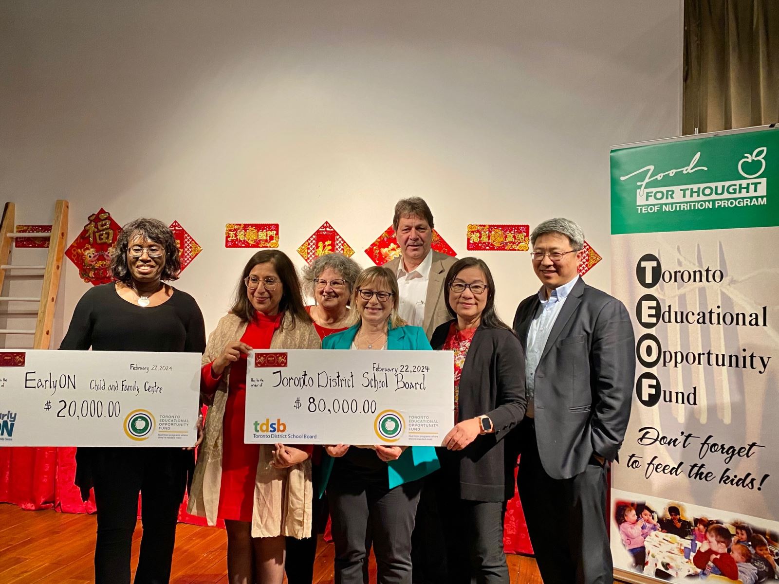 From left to right: Deborah Williams (TDSB Trustee Ward 10), Farzana Rajwani (TDSB Trustee Ward 14), Shelley Laskin (TDSB Trustee Ward 8), Rachel Chernos Lin (TDSB Chair of the Board), Dan MacLean (Trustee Ward 2), Manna Wong (TDSB Trustee Ward 20) and Weidong Pei (TDSB Trustee Ward 12) hold two cheques from the Toronto Educational Opportunity Fund at this year’s Lunar New Year event. 