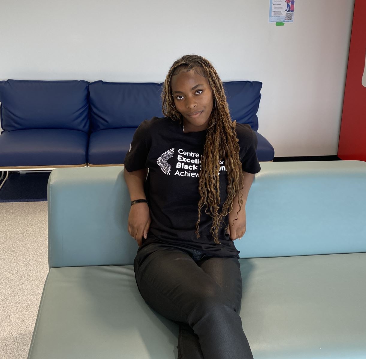 Student sitting on chair and facing the camer