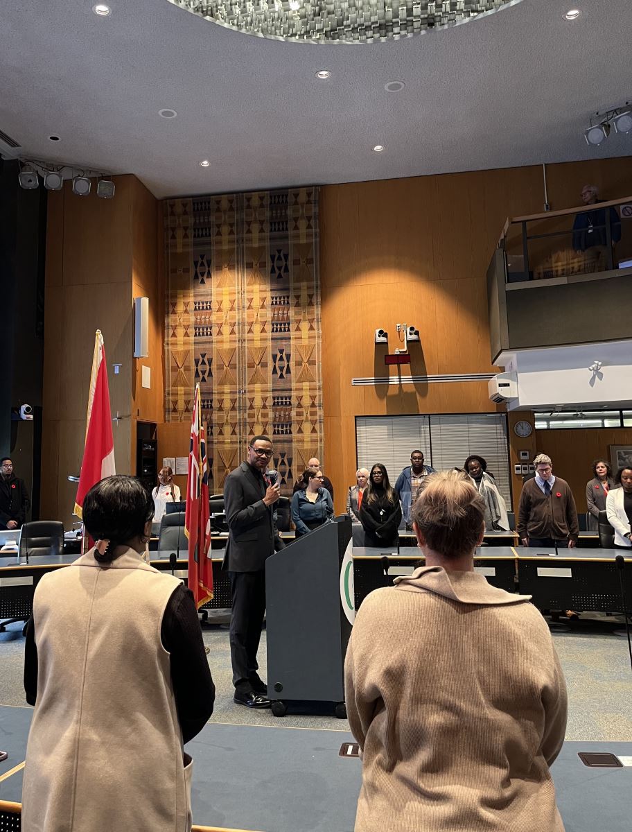 A school classroom door decorated with cut outs of baseballs and children's posters reading "Go Blue Jays"