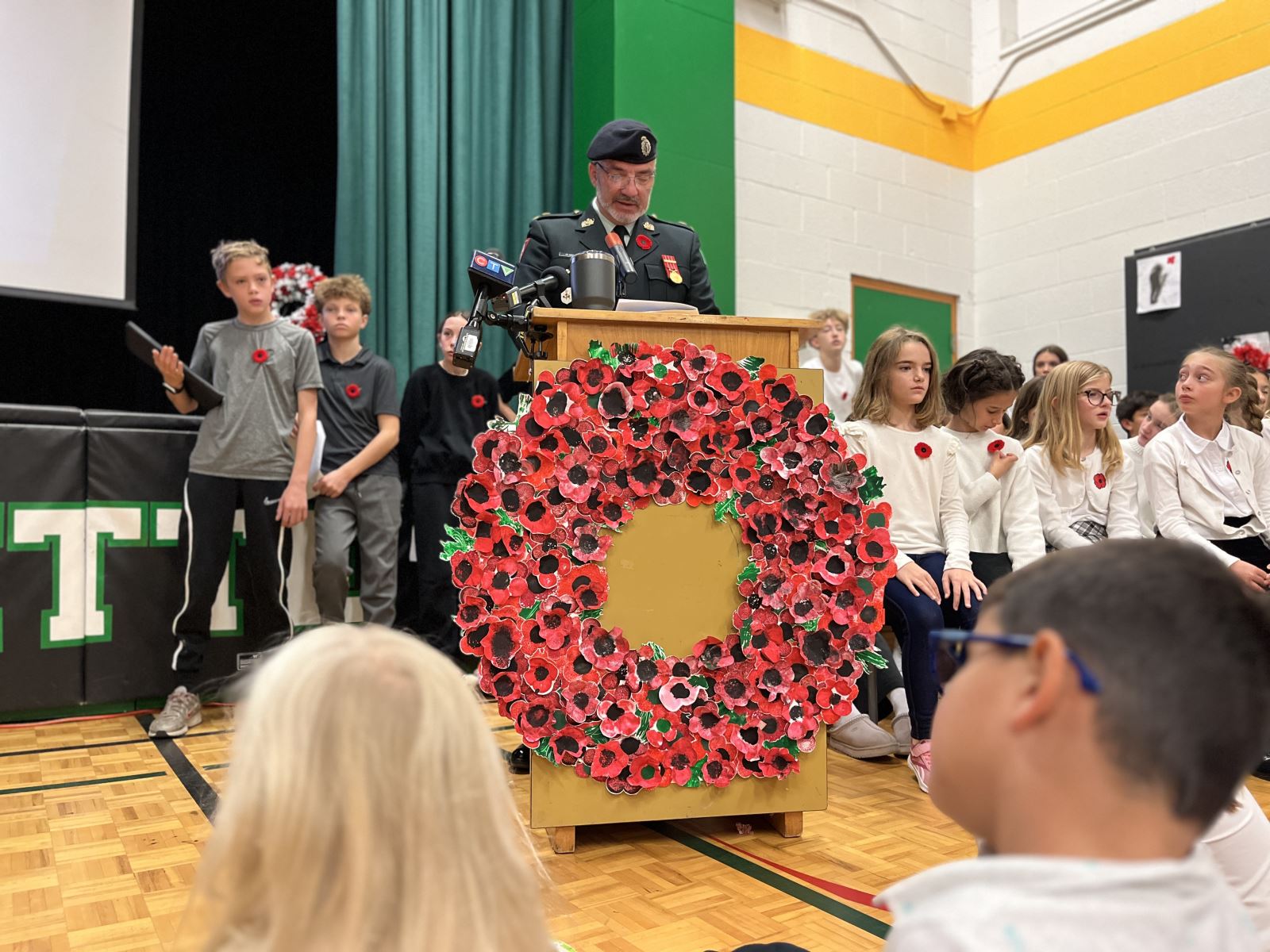 A school classroom door decorated with children's artwork and Blue Jays and logos and signs reading "Go Jays"