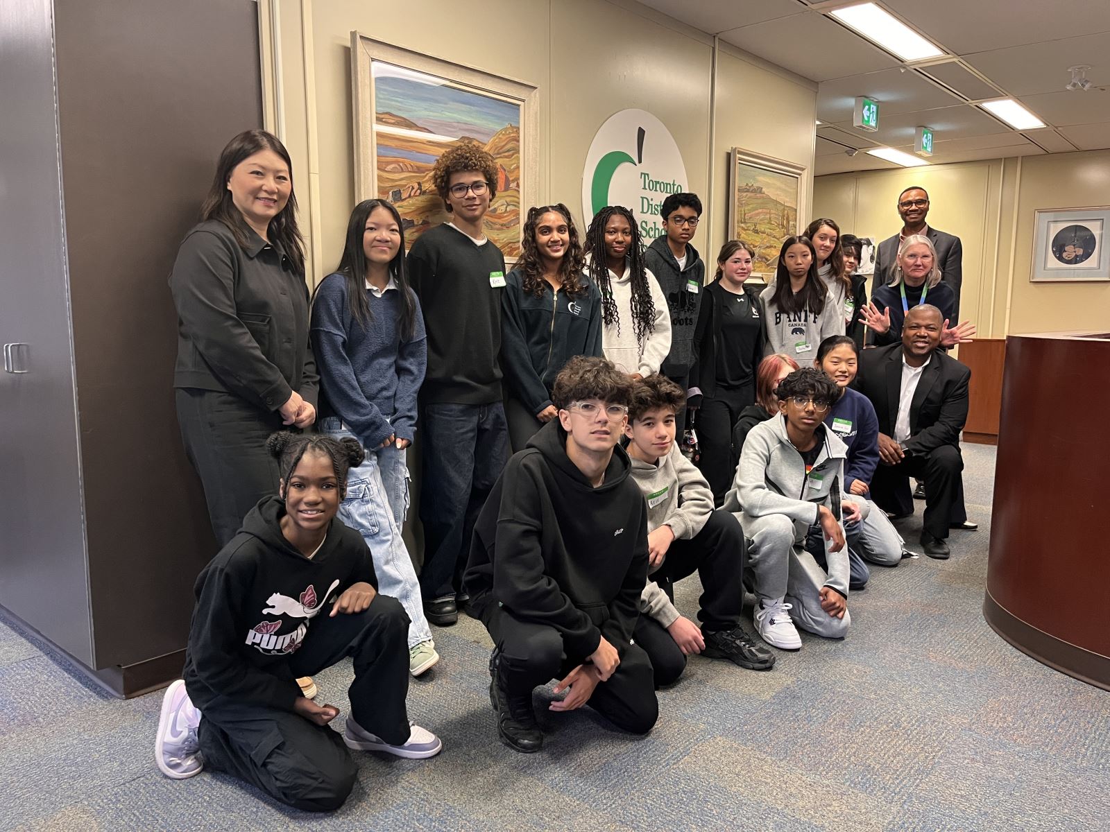 Group of students with the Senior team.