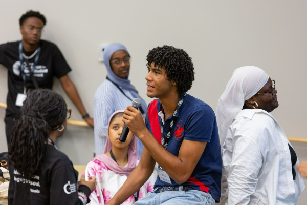 Junior Leader Xavier J. speaking during a reflection activity.