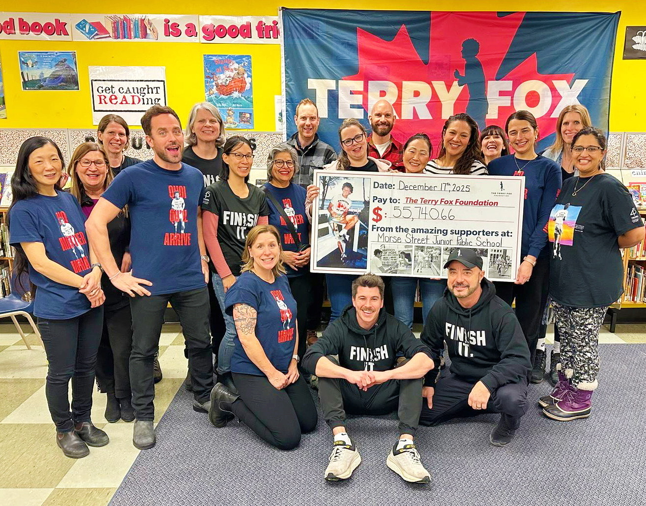 Morse Street PS staff with a cheque for the total money raised for the Terry Fox Foundation.