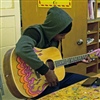 Student playing the guitar