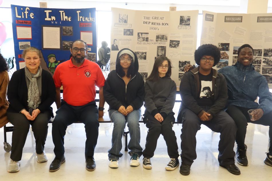 Principal Drummond With Students Exhibits