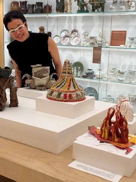 New York-based artist Linda Sormin looking at student artwork m inspired by her art concept displayed on raised platforms at Gardiner Museum in Toronto
