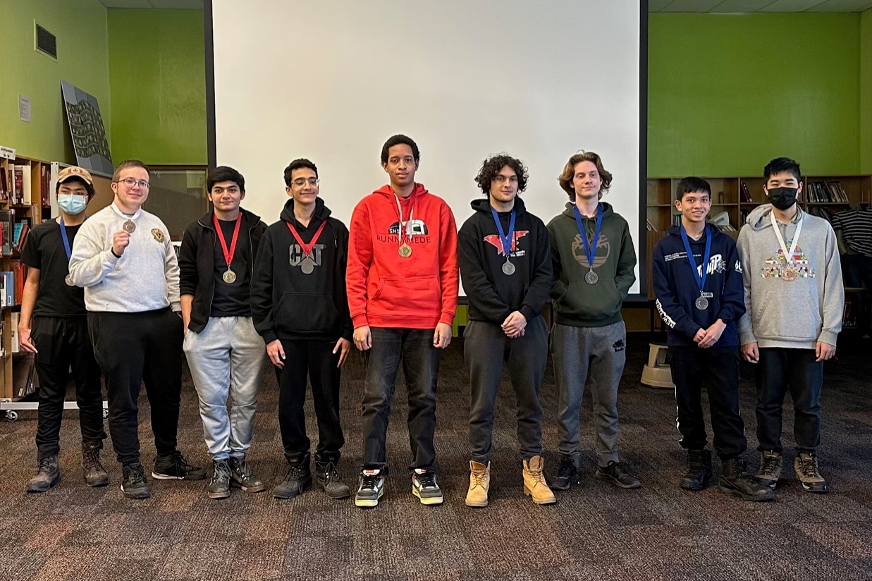 Student competitors wearing their medals