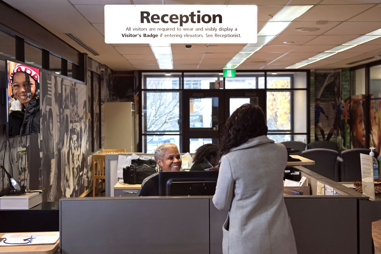 A photo of Sonia greeting a visitor.