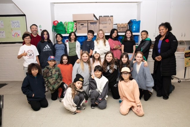 Mr. Tilly’s grade 6 class volunteers at Hillcrest Community Food Bank.