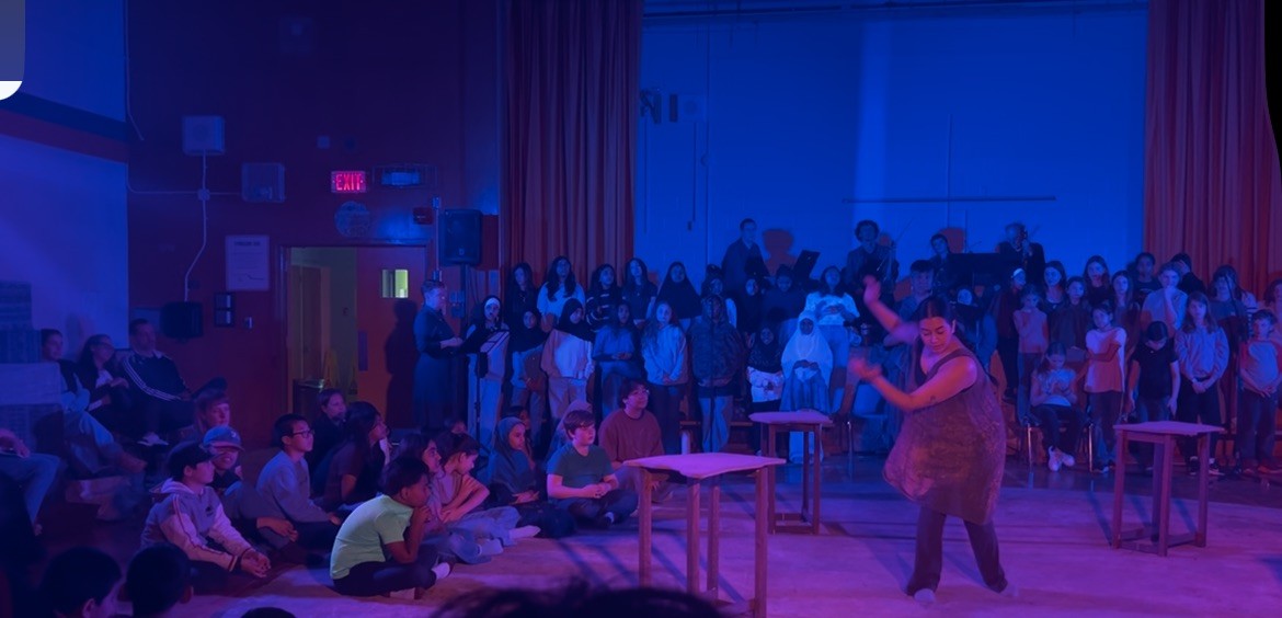 Students watch and perform in What Was My Backyard?