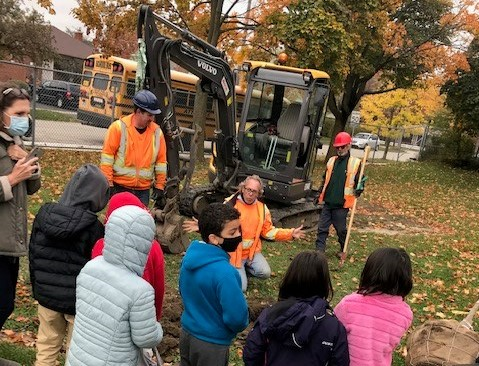 students watching the new tree planting
