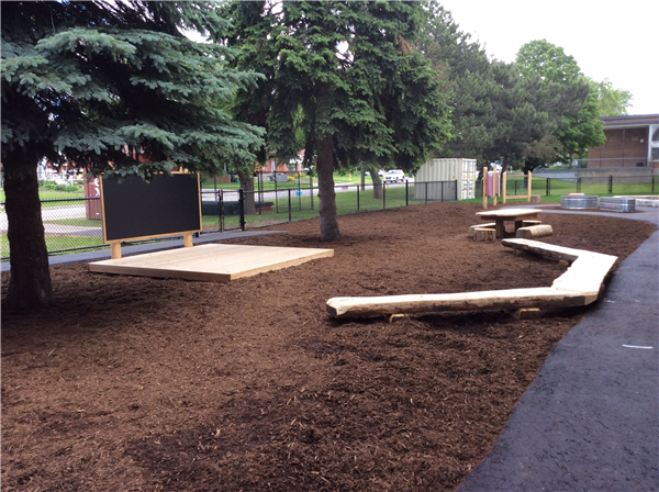 wood stage with log benches