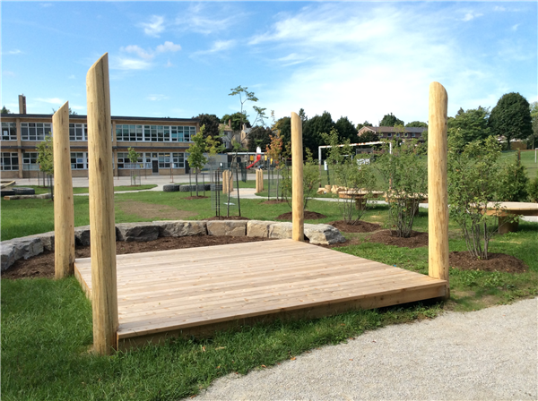 wood stage with 4 posts