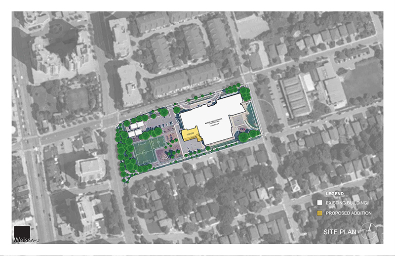 Architectural site plan looking down from above depicting the school & playfield after the project is completed Open Gallery