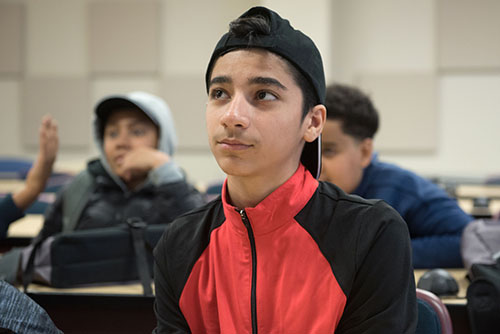 A TDSB student listens to a speaker at the Stand Up Conference. 