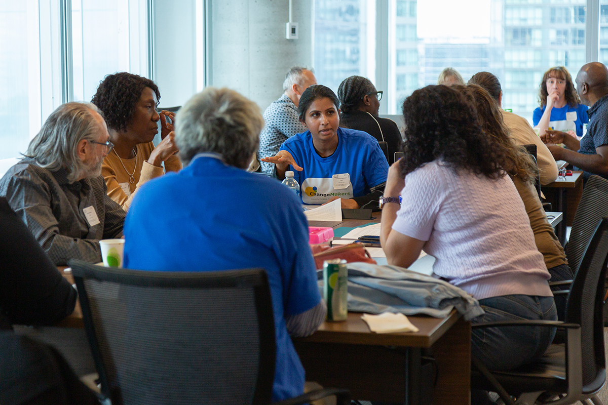 Group of staff seated around table