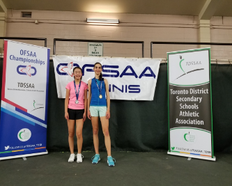 2 girls with OFSAA banner behind