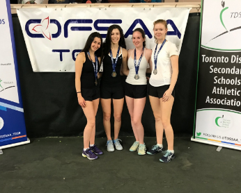4 girls with OFSAA banner behind