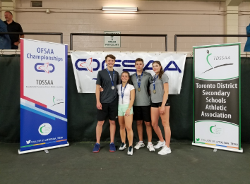 3 girls and 1 boy with OFSAA banner behind