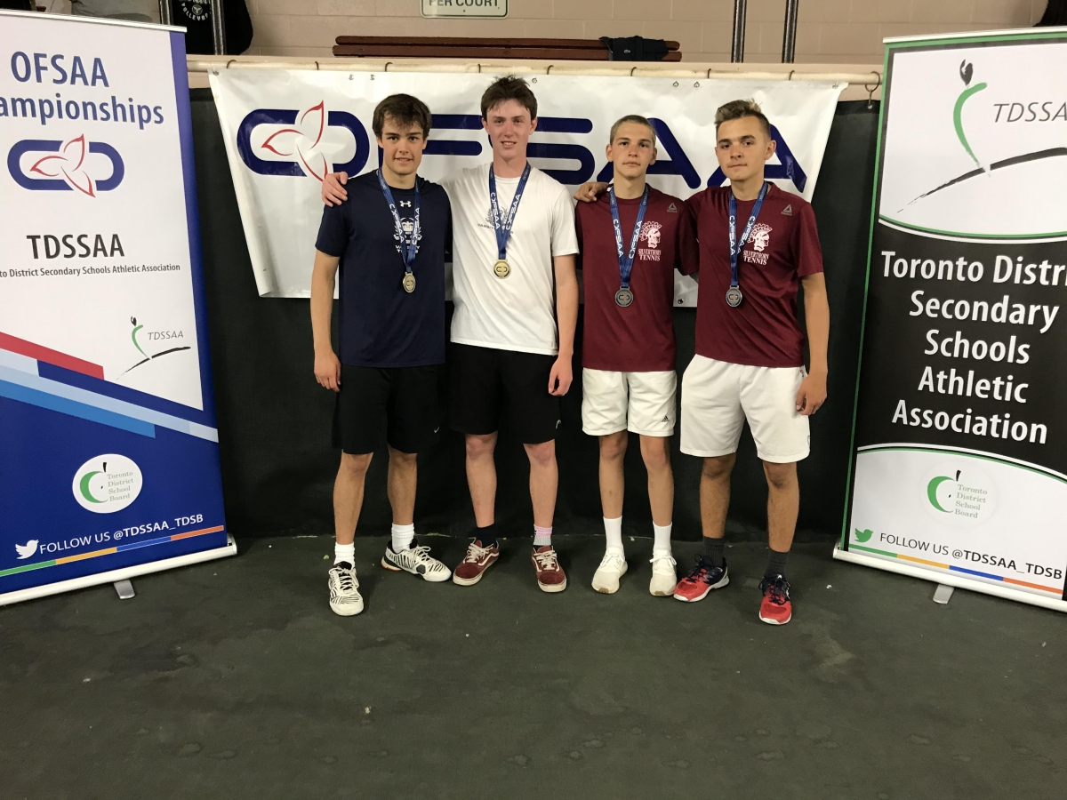 4 boys with OFSAA banner behind
